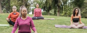 People Practicing Compassionate Mindfulness in Park
